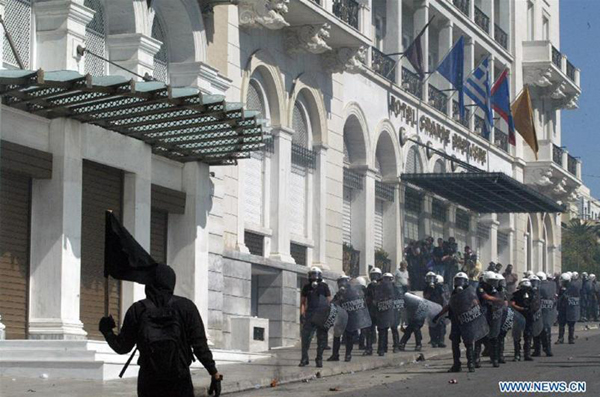 Protestors clash with anti-riot policemen in Athens