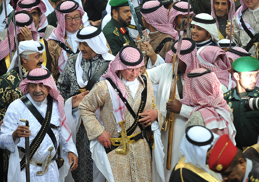 Prince Charles dances in traditional Saudi dress