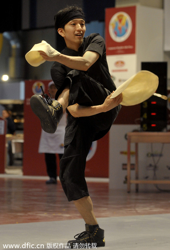 Bakers perform with dough in Pizza World Championships