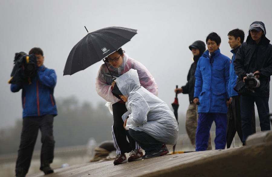 Family members of missing ferry passengers wait for words