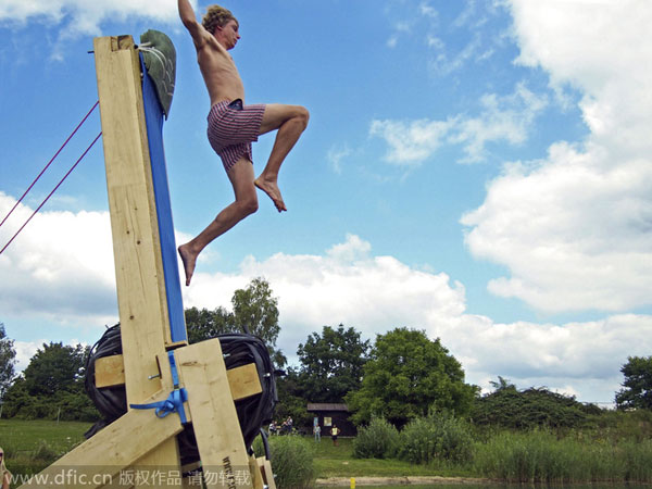 Catapulting into air to dive in lake