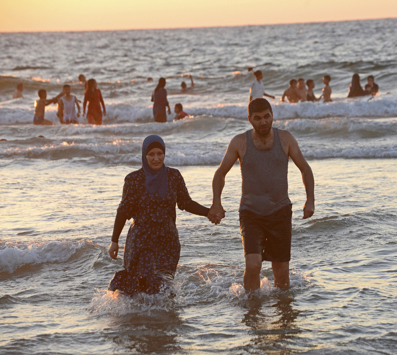 Palestinian Muslims enjoy Mediterranean Sea