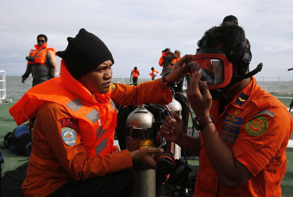 Indonesia official: Some AirAsia victims belted in seats