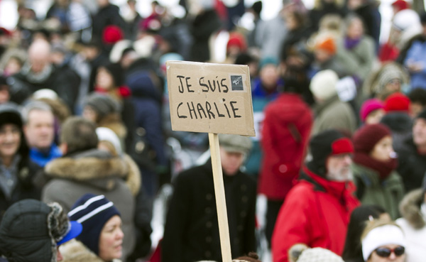 Leaders walk arm-in-arm as millions protest Paris attacks