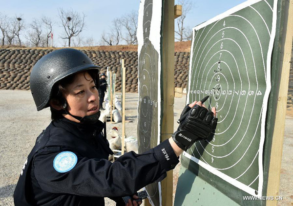 Riot police hone skills before heading for peacekeeping mission