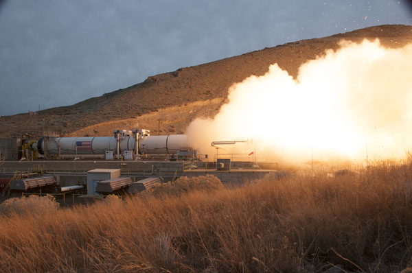 Enhanced space shuttle solid rocket motor passes test firing