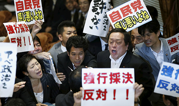 Japan's lower house panel approves controversial security bills