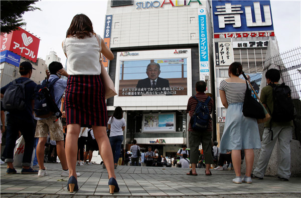 Japan's emperor speaks to public in remarks suggesting he wants to abdicate