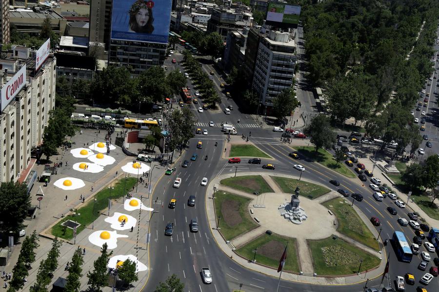 Streets are alive with giant fried eggs in Santiago