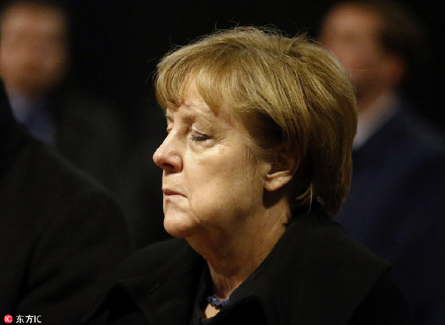 Merkel, Hollande vow 'merciless war' against terrorism