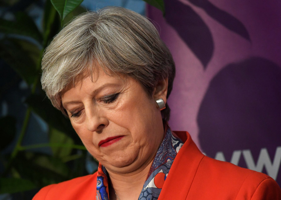 Exit polls show May's Conservatives could lose majority