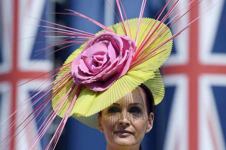 Despite high temps, Royal Ascot-goers don finest outfits